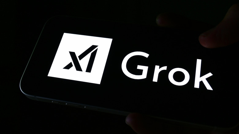 Логотип Grok на черном экране